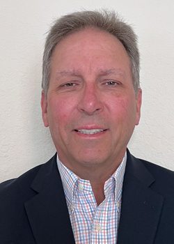 Jim Kenyon profile picture wearing a striped dress shirt and suit coat